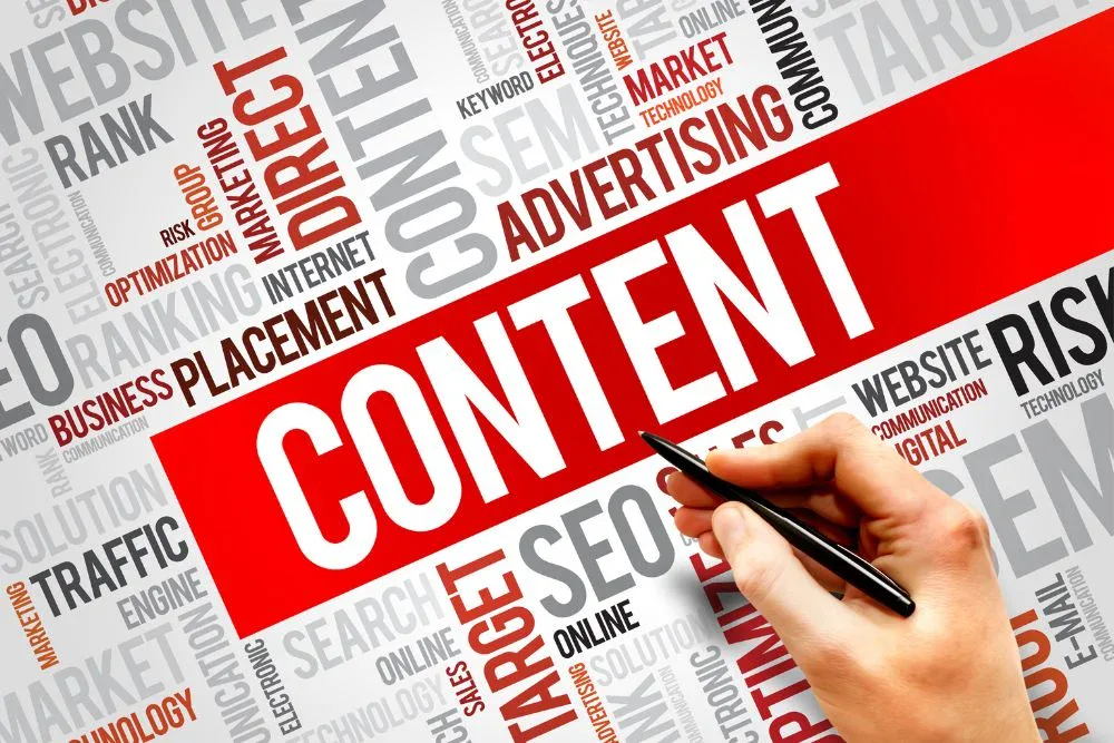 A hand holding a black pen points toward a large, bold white word "CONTENT" displayed on a vibrant red banner.