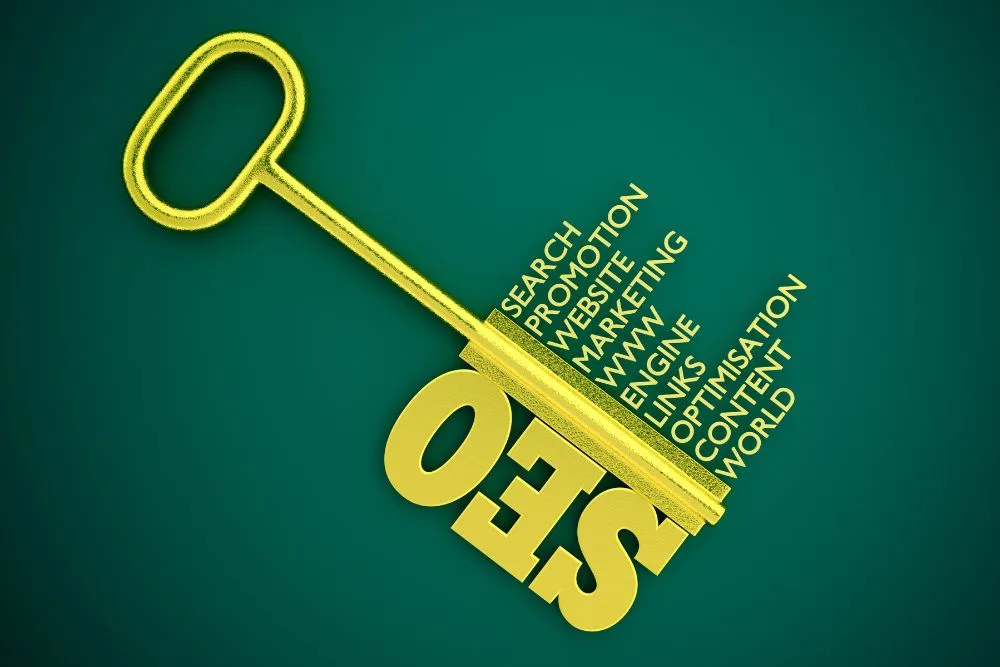 A top-down view of a large, golden key against a dark teal background.