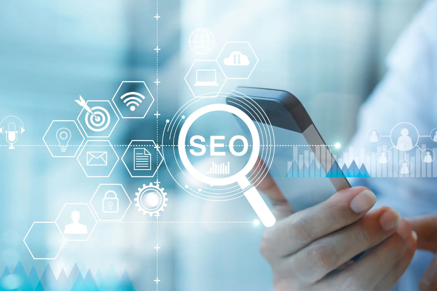 SEO representations with a hand holding phone in the background