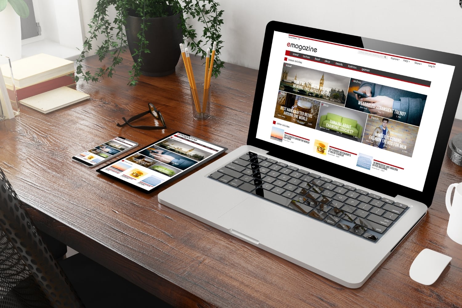 Should I Add a Blog to My Business Website? - Blog A business blog post displayed on a desktop monitor showing a well-structured article with a descriptive heading, clear subheadings, body text, and a visible call to action button at the end of the article